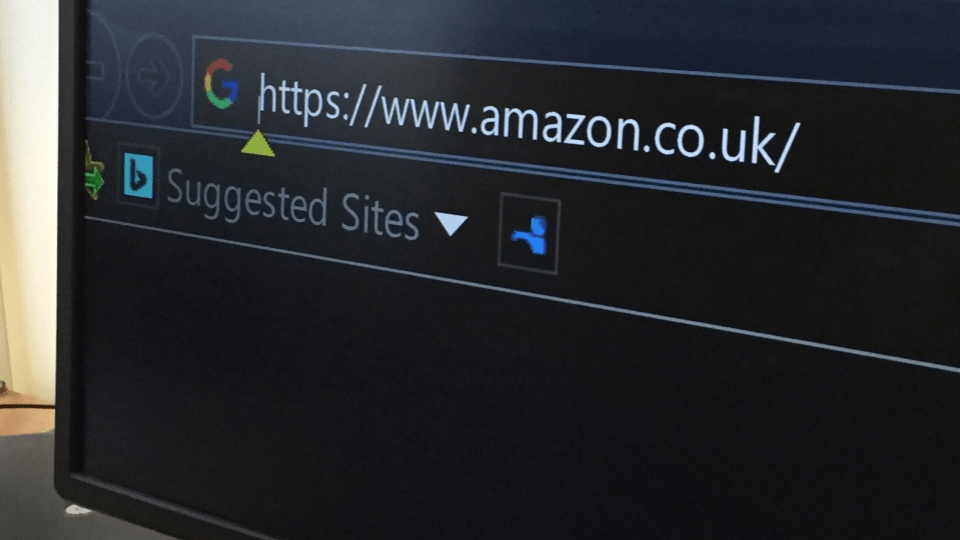 A browser with very large white text and a black background. The user has typed in the amazon website address.